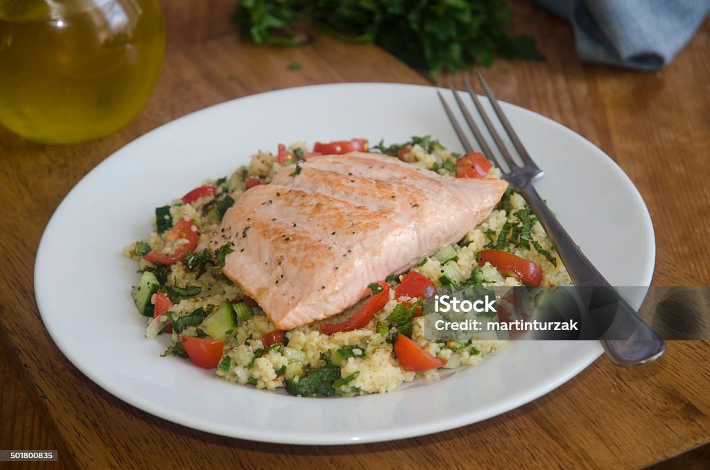 Salmon with tabbouleh Baked salmon steak with tabbouleh on a plate Fish Stock Photo