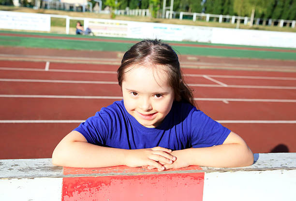 istock Little girl have fun on stadium 501813162
