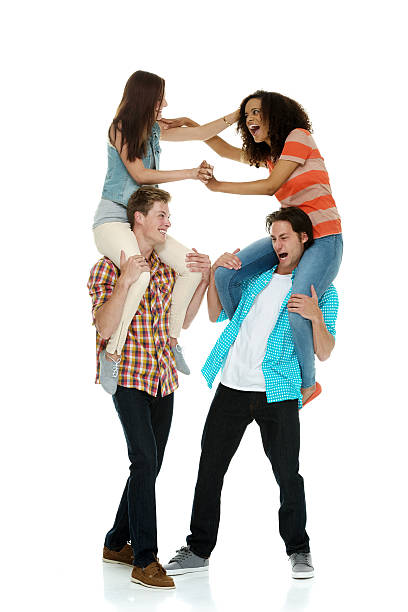 istock Two women fighting on men's shoulders 501813823