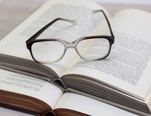 istock glasses and open books on the table 501813881