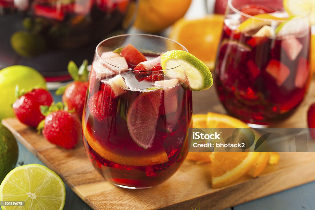 Homemade Delicious Red Sangria Homemade Delicious Red Sangria with Limes Oranges and Apples Alcohol - Drink Stock Photo