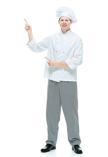 istock Smiling male chef pointing away 501814440