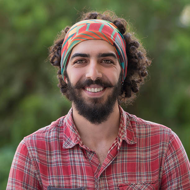 istock Portrait of young man smiling to camera 501815368