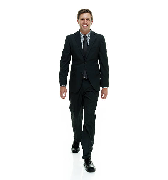 istock Cheerful businessman walking and looking at camera 501816168