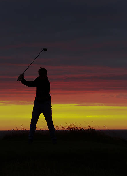 istock Golfer's final drive of the day in the sunset. 501816521