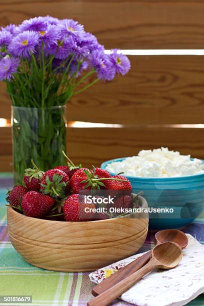 Strawberries In The Wooden Bowl And Cottage Cheese Stock Photo - Download Image Now - Berry Fruit, Blossom, Blue