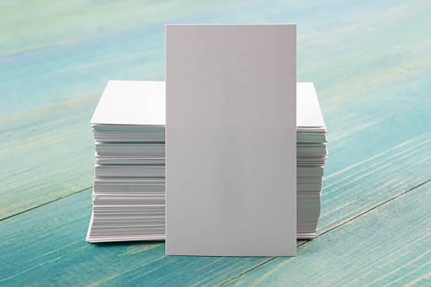 istock Blank white business cards on blue wood background 501816726