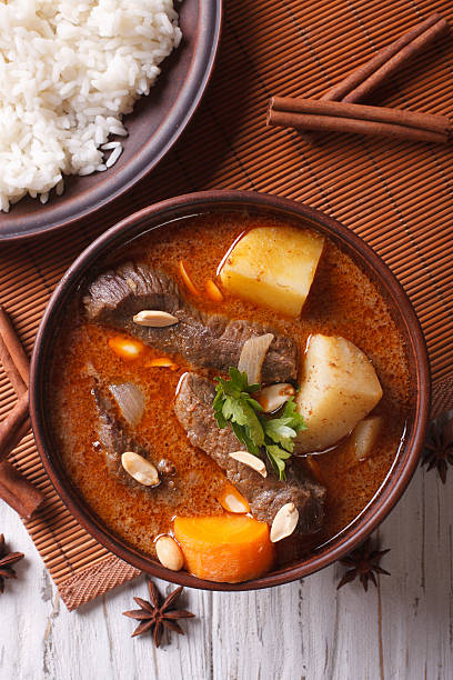 istock Thai beef massaman curry and rice closeup. vertical top view 501816910