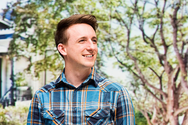 istock Smiling casual man outdoors and looking away 501817048