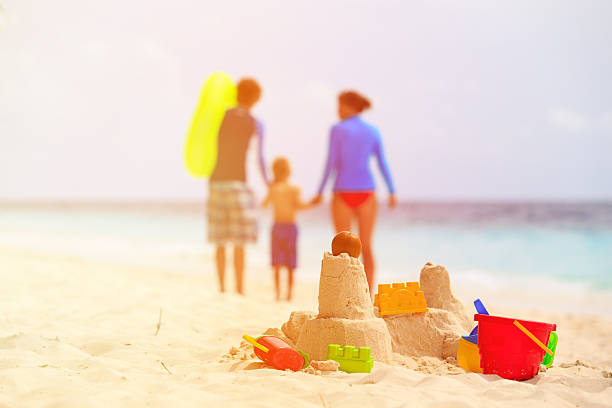 istock sand castle on tropical beach, family vacation 501817050
