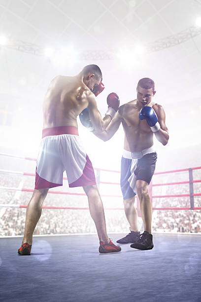 istock Two professionl boxers are fighting on arena 501817812