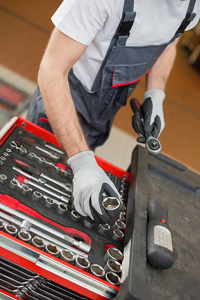 istock High angle view of male mechanic arranging tools 501818079