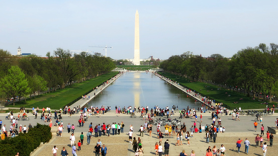 National Mall bustling with tourists on a spring day.