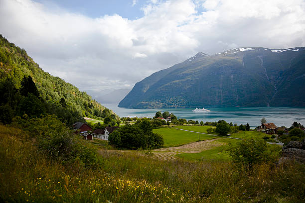istock Norwegian fjord with cruise ship. 501819675