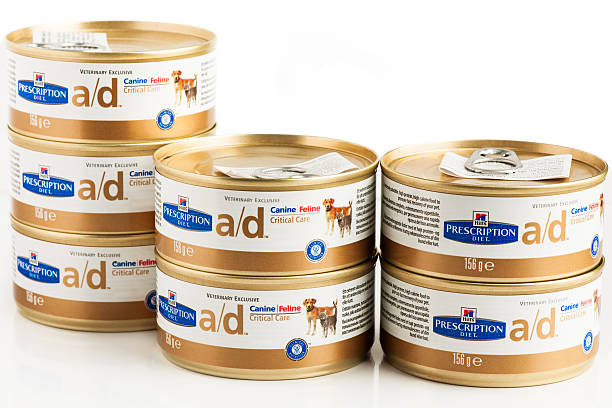 Bucharest, Romania - May 29, 2014: Hills prescription diet critical cares a/d canine, feline food. An extremely palatable, high protein, high calorie feline, canine food 156 g cans isolated on white.