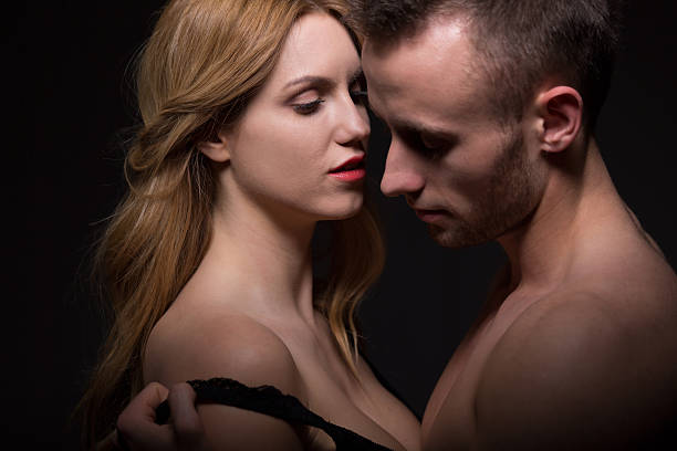 istock Aroused man undressing a woman 501821026