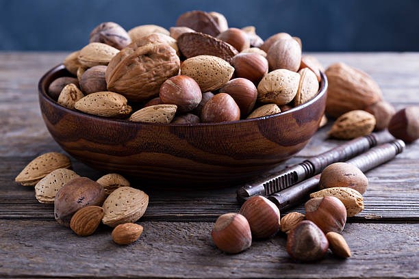 istock Variety of nuts with shells in a bowl 501822782