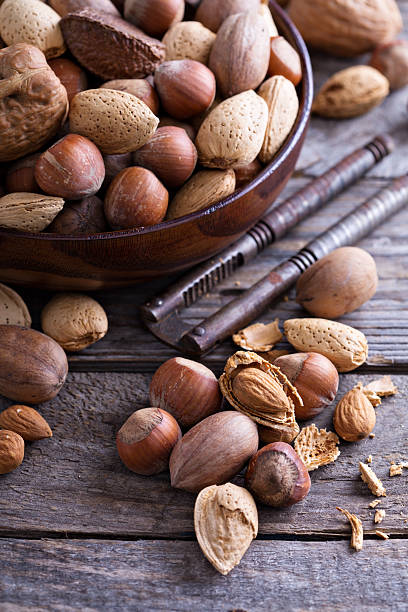 istock Variety of nuts with shells in a bowl 501822828