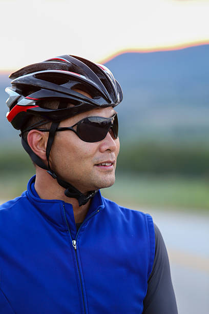 istock Cyclist resting on the side of the road during sunset 501823236
