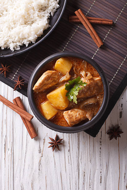 istock Thai massaman curry with chicken and rice. vertical top view 501824988
