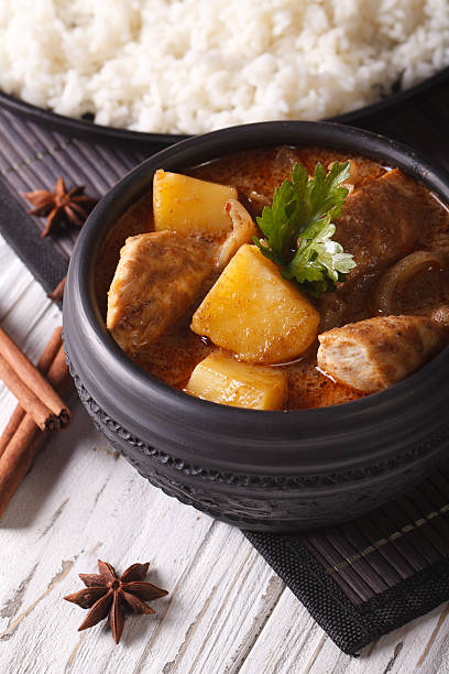 istock Traditional massaman curry with chicken and rice. Vertical 501825778