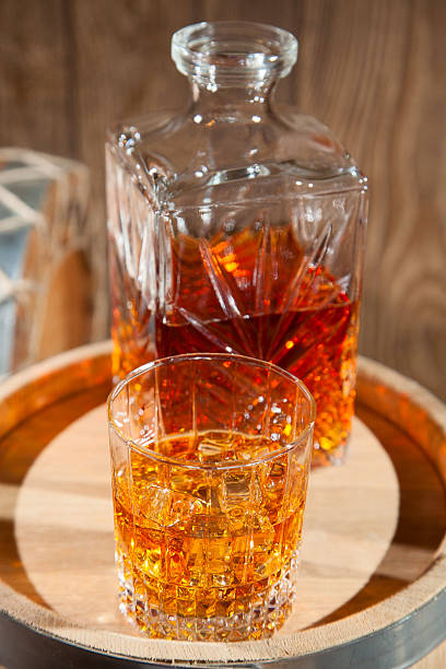 istock Glass of whiskey with ice and a decanter 501825864