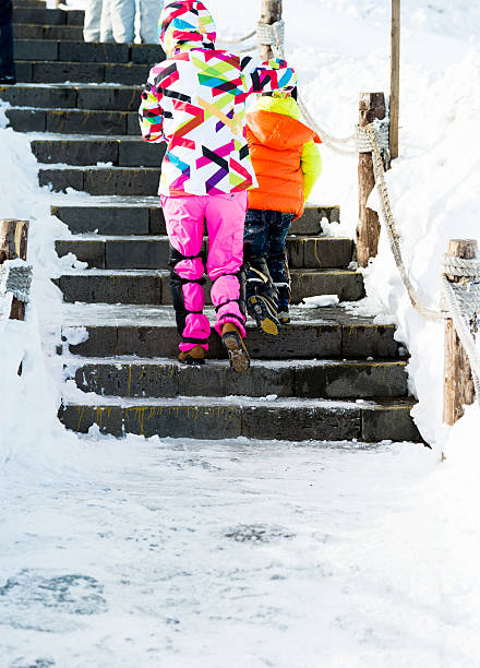 istock Little boy and his mother climbing stairs 501827428