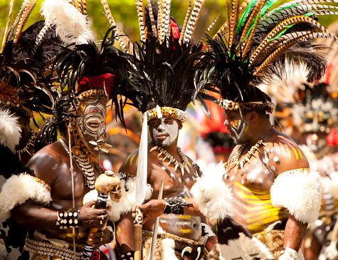 St. John, US Virgin Islands - July 4, 2014: warriors troupes dancing during a month-long St. John Festival and Carnival, the theme for 2014's Festival was \