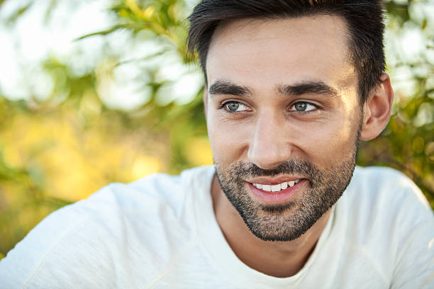 Portrait of a young handsome man taken outdoors just before sunset.