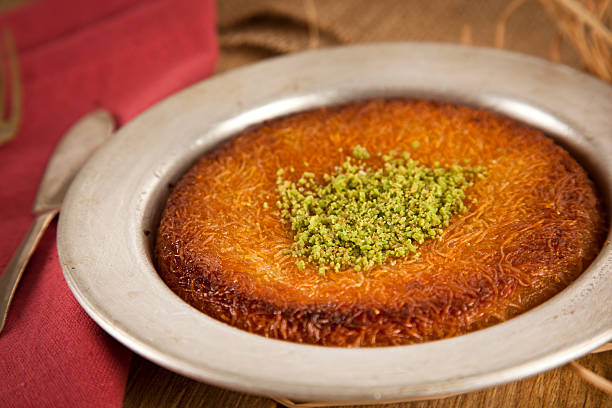 istock Turkish dessert kunefe with pistachio powder 501835107