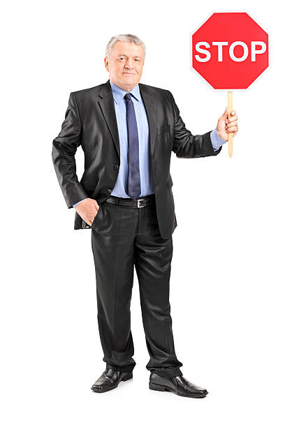 istock Mature businessman holding a stop sign 501835241