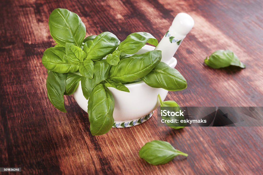 Fresh herbs. Basil. Fresh aromatic herbs on brown wooden background. Culinary cooking herbs. Basil Stock Photo