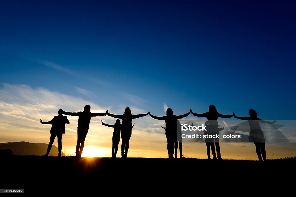 unity makes us free friends with arms raised feeling free and happy. 20-29 Years Stock Photo