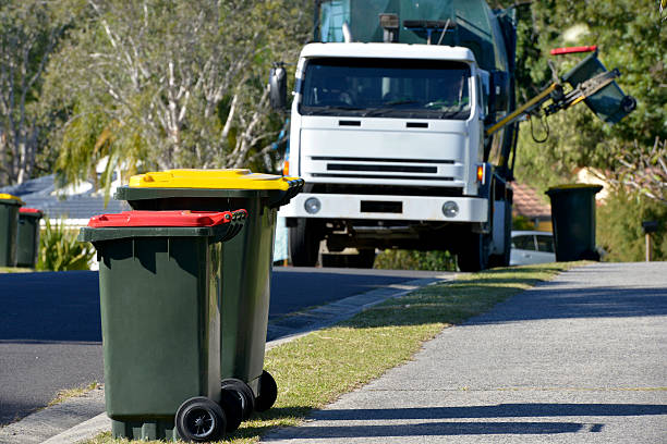 istock Rubbish bins with rubbish truck in background lifting a bin 501837441