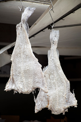 Salted dried cod fish hanging.