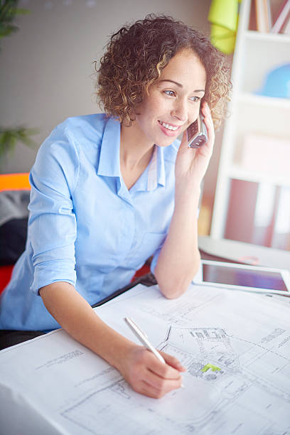 istock female architect on the phone 501843716