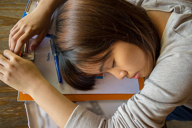 istock Hard-working employee sleeping on reports in the lunch time 501845464