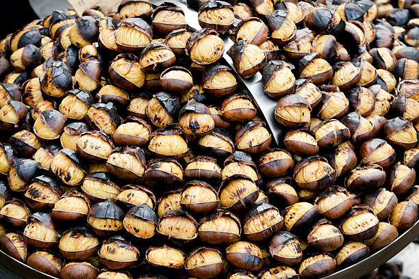 istock roasted chestnuts in an Roman street 501846136