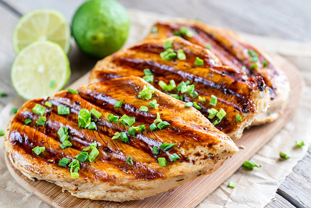 Grilled chicken breasts in lime sauce Grilled chicken breasts in lime sauce marinated photos stock pictures, royalty-free photos & images