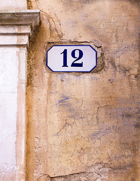 istock Number 12 Street Address Tile On Ancient Mottled Wall 501848030