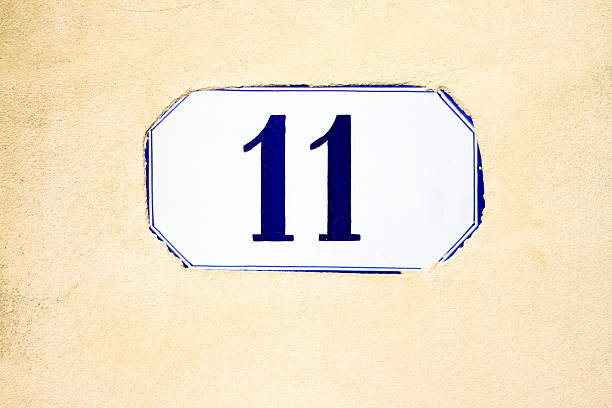 istock Number 11 Street Address Tile, Pretty Yellow Stucco Wall 501848144