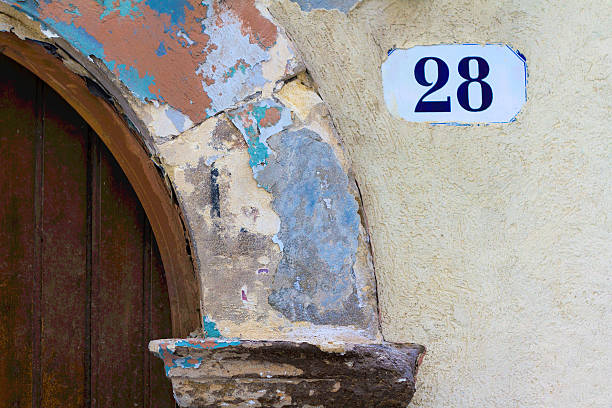 istock Number 28 Street Address Tile On Mottled Old Arched Wall 501848254