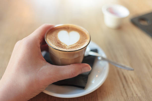 istock Close up of female hand holding a small coffee 501848446