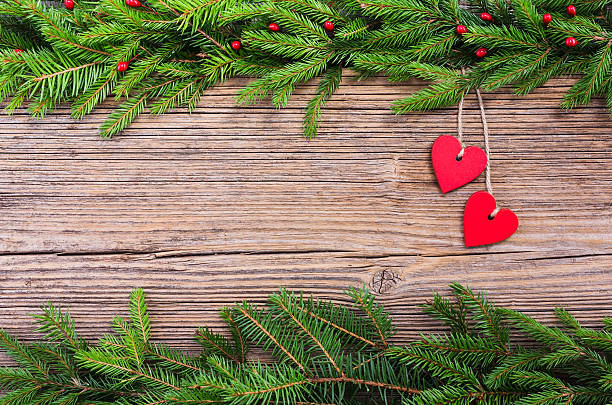 istock Christmas  tree with red hearts on  wooden  background, copy space 501849176