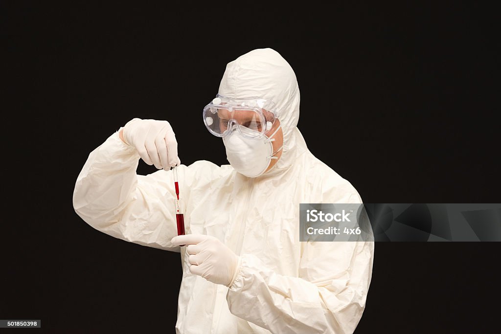 Scientist collecting blood samples Scientist collecting blood sampleshttp://www.twodozendesign.info/i/1.png 2015 Stock Photo