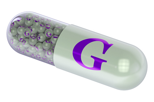 Vitamin capsule G isolated on white background