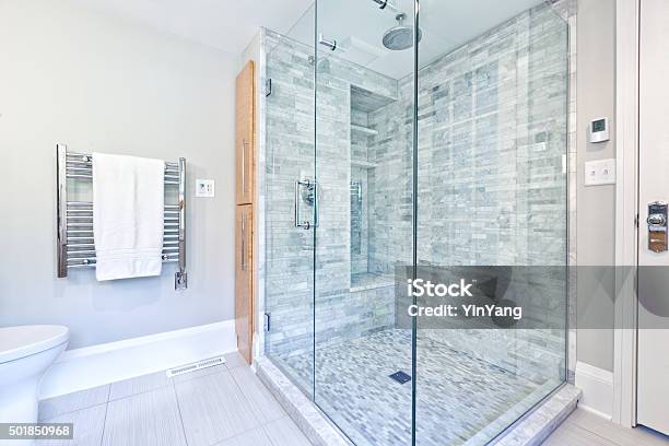 Contemporary Home Bathroom Glass Shower Stall With Marble Tiles Stock Photo - Download Image Now