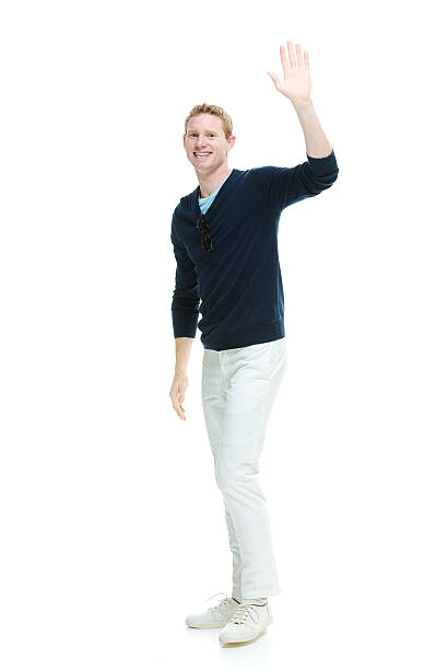 istock Smiling casual man waving hand 501850998
