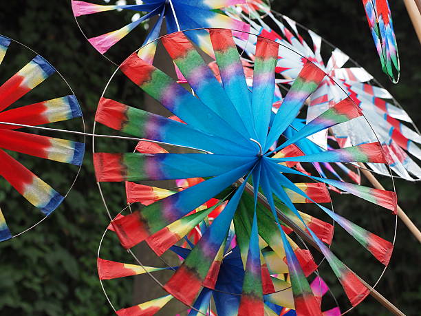 istock Colorful windmills wind wheels on market 501852488