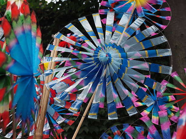 istock Colorful windmills wind wheels on market 501852504